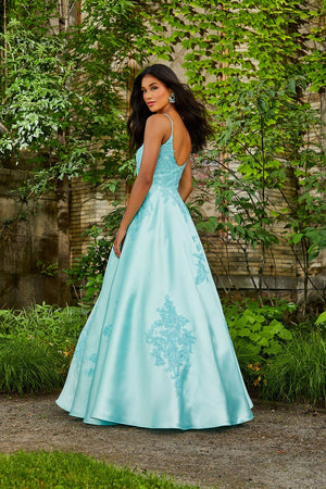 Morilee 47056 by Madeline Gardner dress images. Morilee 47056 is available in these colors: Black, Royal, Aqua, White.